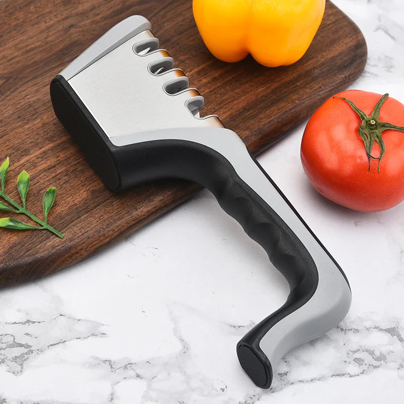Manual Knife & Scissor Sharpener on cutting board on kitchen counter next to vegetables ready to be prepared