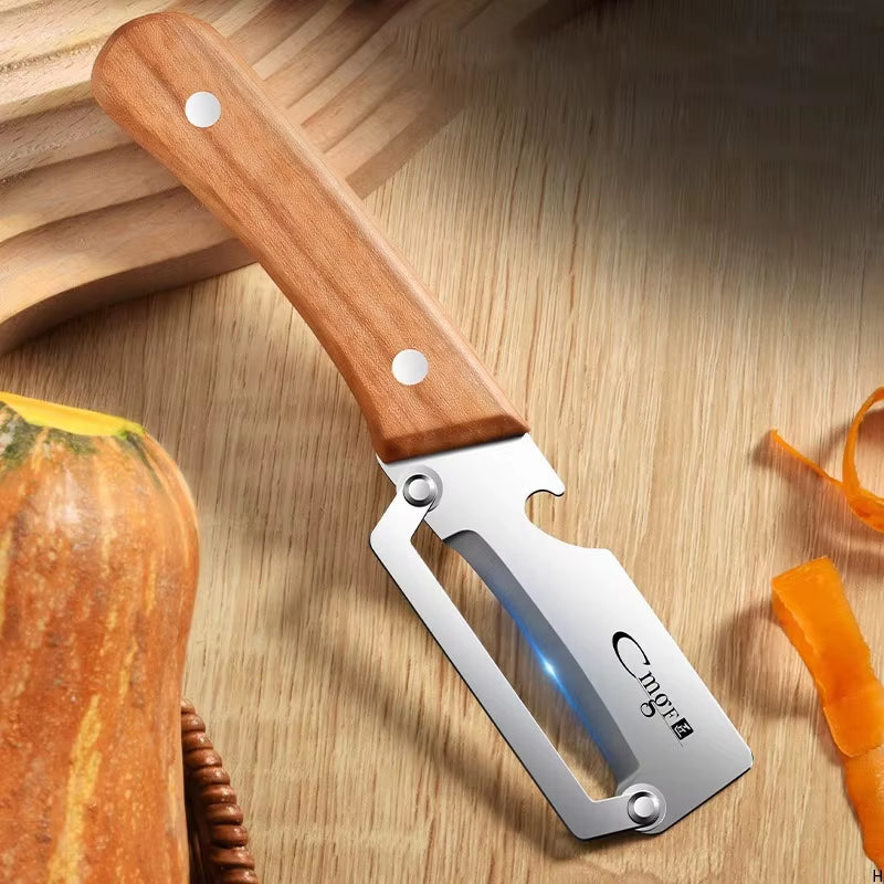 Premium Stainless Steel Kitchen Peeler on kitchen counter next to peeled squash and cutting board
